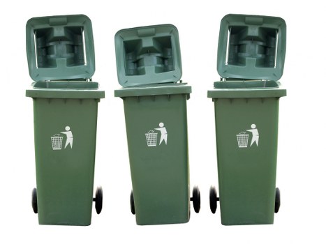 Three green wheeled rubbish bins with their lids open are arranged in a row on a paved surface, with the middle bin slightly tilted to the left and the other two aligned vertically. The bins are made of plastic, featuring a textured finish and a white icon of a person disposing of waste on the front, indicating their purpose for waste collection. The background is plain with a neutral, seamless white backdrop, emphasizing the bins without any environmental context. The open lids reveal the interior compartments, designed to hold general waste or recyclables, typical of waste management services in residential or commercial settings. The wheels at the base of each bin are black, and the bins' green colour complements the outdoor environment associated with waste disposal and recycling efforts, such as in West Byfleet or nearby areas in Surrey. These bins are part of a typical rubbish collection setup, possibly used by companies like Commercial Waste West Byfleet for efficient waste removal in the local community.